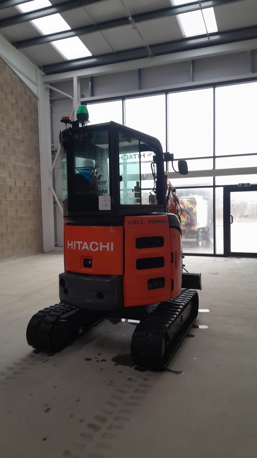 HPM Hitachi excavator in workshop Isle of Man
